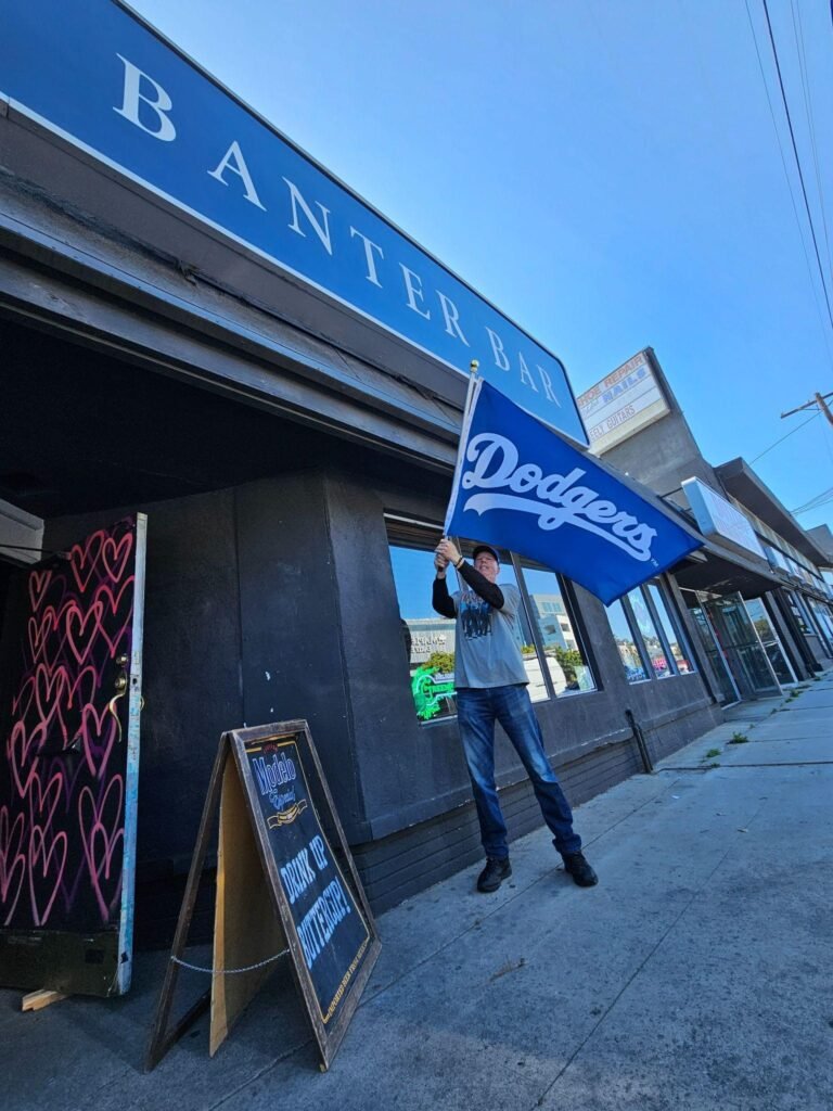 Dodgers Fan Holds Banner Outside Banter Bar